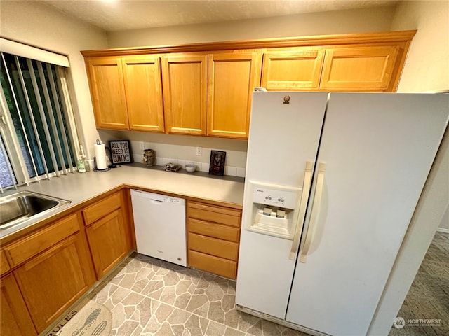 kitchen with white appliances and sink