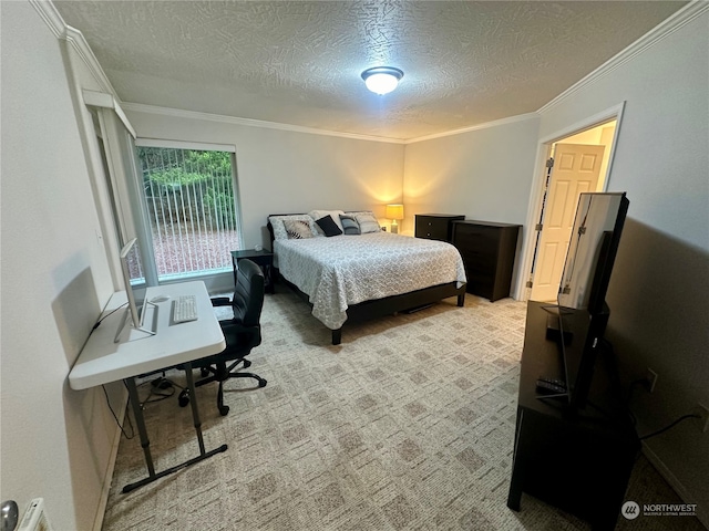 carpeted bedroom featuring ornamental molding and a textured ceiling