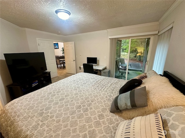 carpeted bedroom with access to exterior, ornamental molding, and a textured ceiling