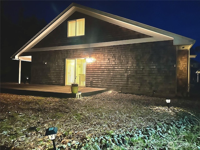 146 28th St NW, Long Beach, WA 98631 - back of house at night featuring a deck
