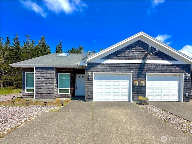 146 28th St NW, Long Beach, WA 98631 - view of front of home with driveway and a garage