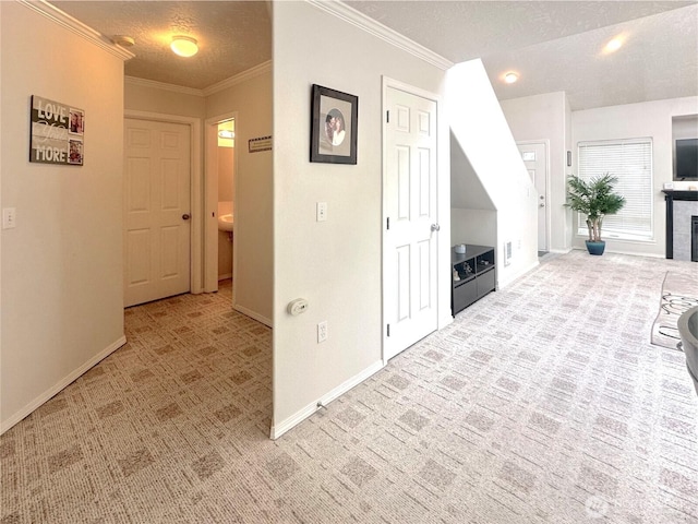 146 28th St NW, Long Beach, WA 98631 - corridor with carpet floors, baseboards, crown molding, and a textured ceiling