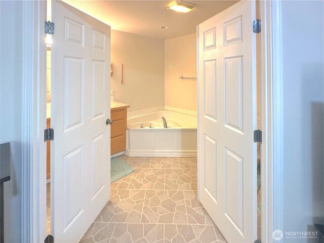 146 28th St NW, Long Beach, WA 98631 - full bathroom with a garden tub and recessed lighting
