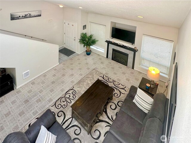 146 28th St NW, Long Beach, WA 98631 - living area featuring a tiled fireplace and baseboards