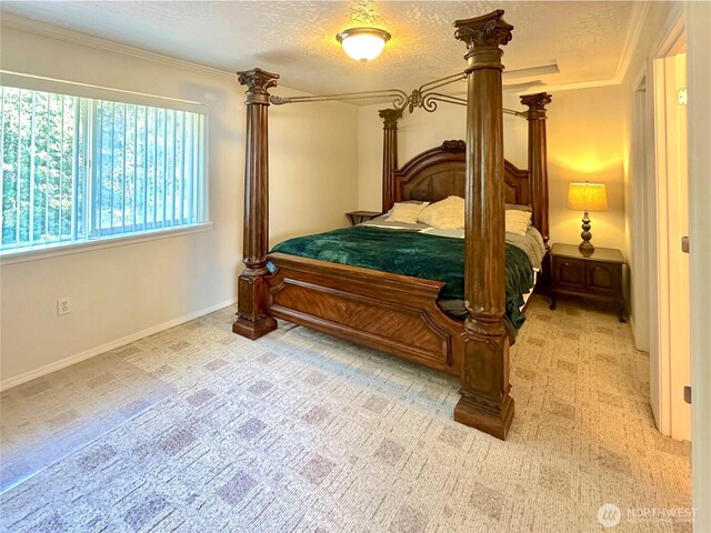 146 28th St NW, Long Beach, WA 98631 - bedroom featuring light colored carpet, baseboards, a textured ceiling, and ornamental molding