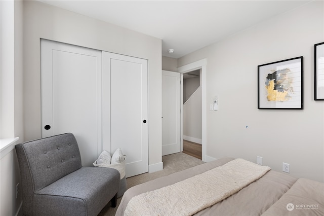 bedroom featuring light carpet