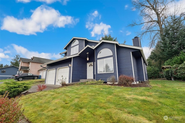 view of front of house featuring a front lawn and a garage