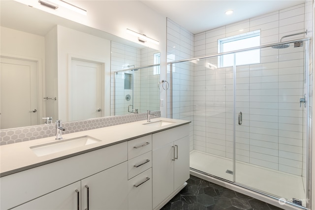 bathroom with tile patterned flooring, vanity, and an enclosed shower