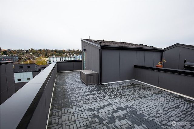 view of patio featuring a balcony