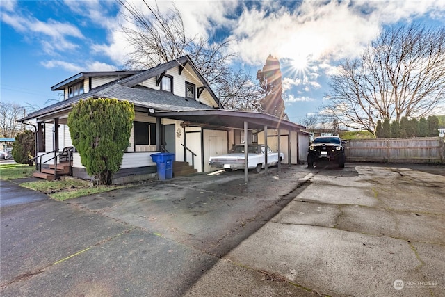 view of side of property with a carport