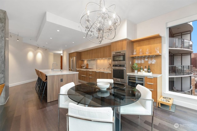 1920 4th Ave Unit 1802, Seattle, WA 98101 - dining room with wine cooler, dark wood finished floors, a chandelier, recessed lighting, and bar area