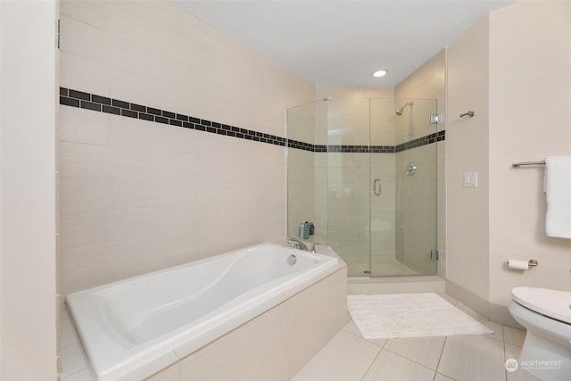 1920 4th Ave Unit 1802, Seattle, WA 98101 - bathroom with a garden tub, a shower stall, and tile patterned floors
