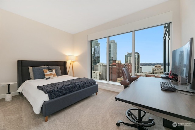 1920 4th Ave Unit 1802, Seattle, WA 98101 - carpeted bedroom with a desk and baseboards