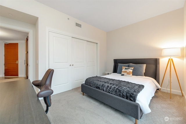 carpeted bedroom with a closet