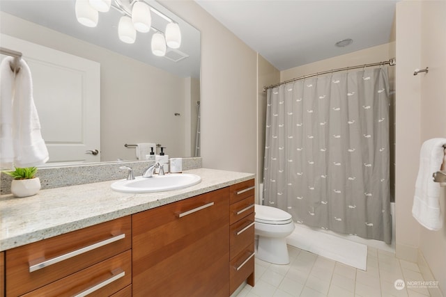 full bathroom with tile patterned flooring, vanity, shower / bath combo, and toilet