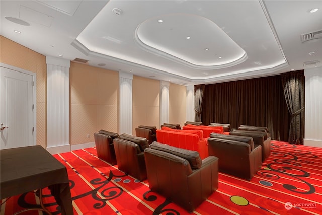 home theater with a raised ceiling