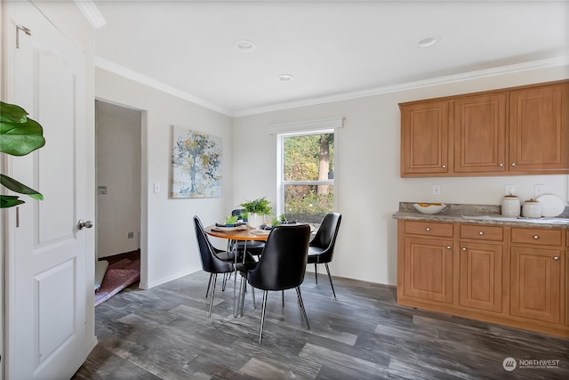 dining area with dark hardwood / wood-style floors and ornamental molding