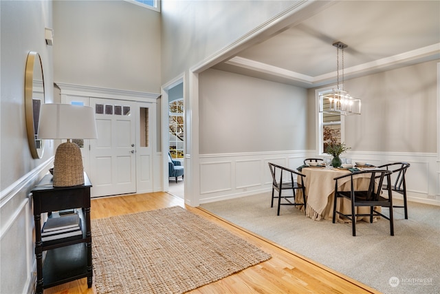 foyer featuring an inviting chandelier and light hardwood / wood-style flooring