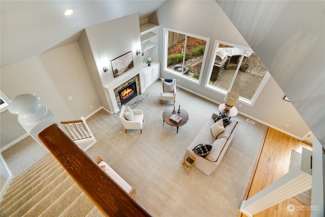 living room with wood-type flooring and vaulted ceiling