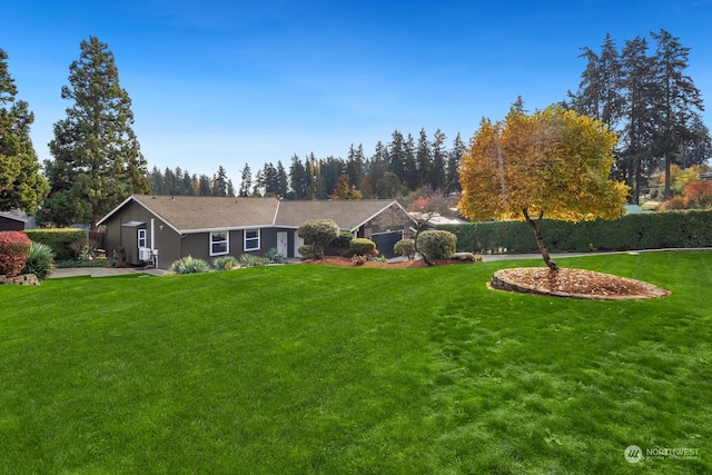 ranch-style house featuring a front lawn