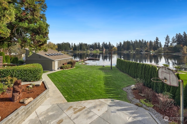 view of yard featuring a boat dock and a water view