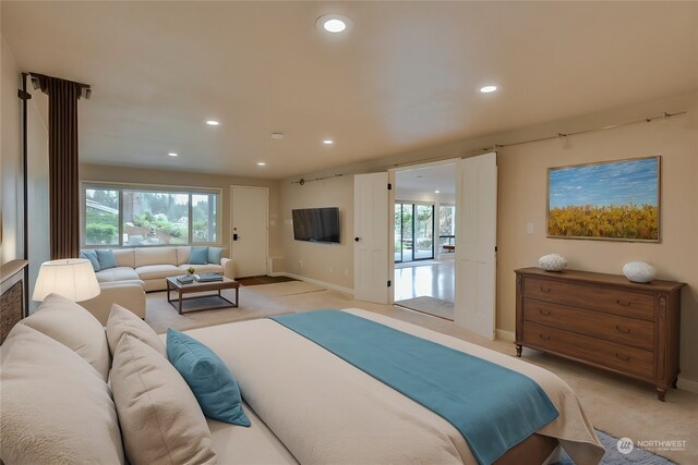 bedroom with light colored carpet