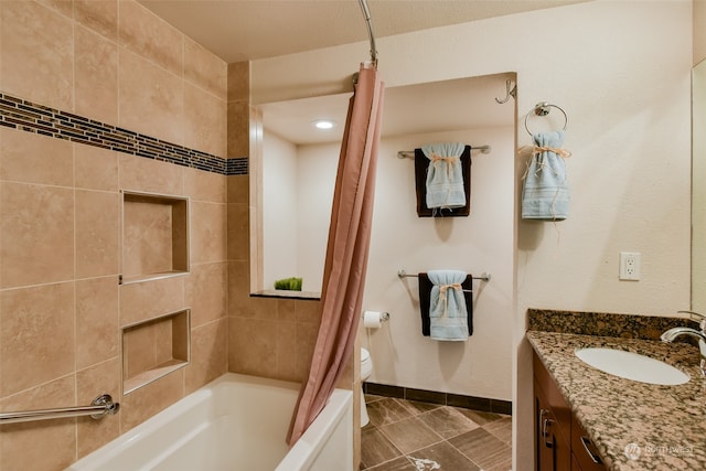 full bathroom with shower / bath combo with shower curtain, vanity, and toilet