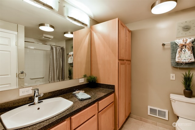 bathroom with vanity, tile patterned flooring, a shower with shower curtain, and toilet