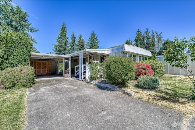 view of front of house with a carport