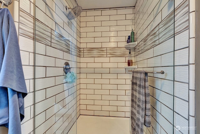 bathroom with a tile shower