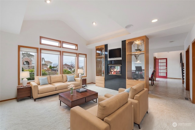 living room featuring light carpet and high vaulted ceiling