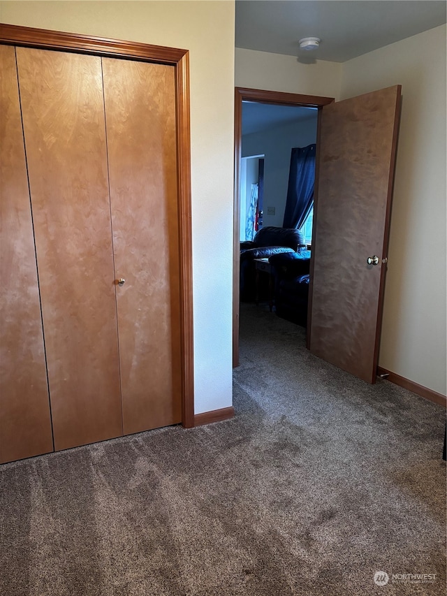 unfurnished bedroom with carpet flooring