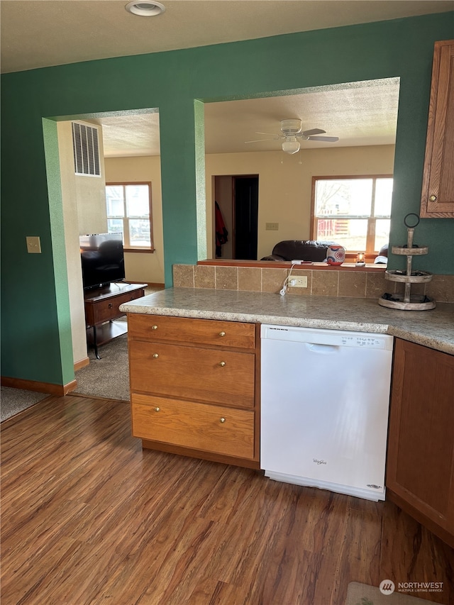 kitchen featuring ceiling fan, dark hardwood / wood-style floors, and white dishwasher