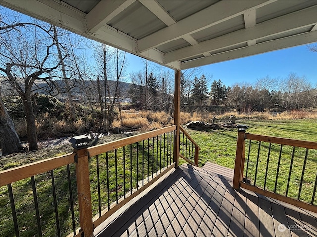 deck featuring a yard