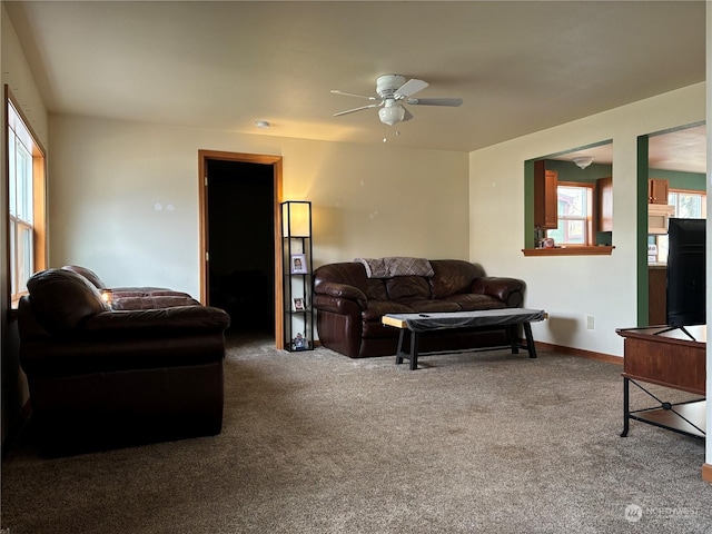 living room with carpet and ceiling fan