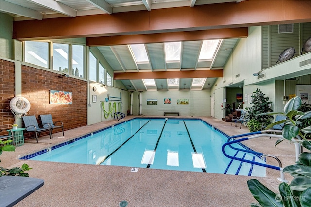 view of pool featuring a skylight