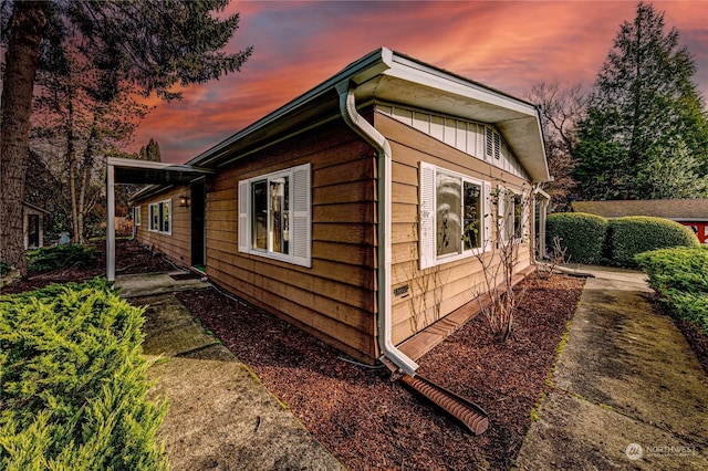 view of property exterior at dusk