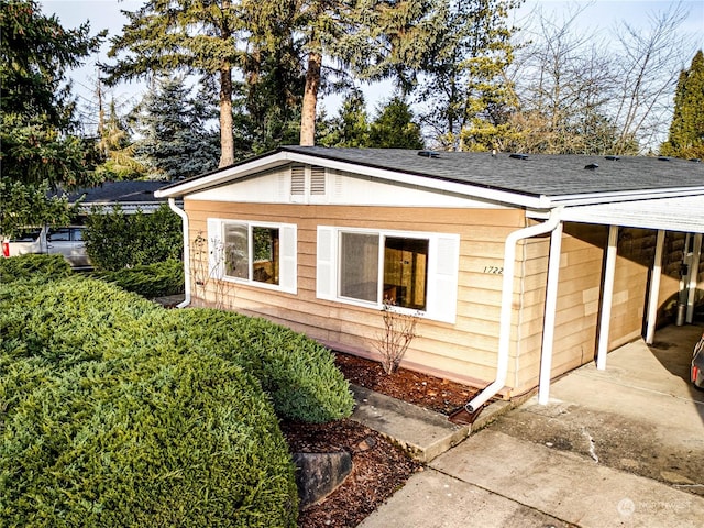 exterior space featuring a carport