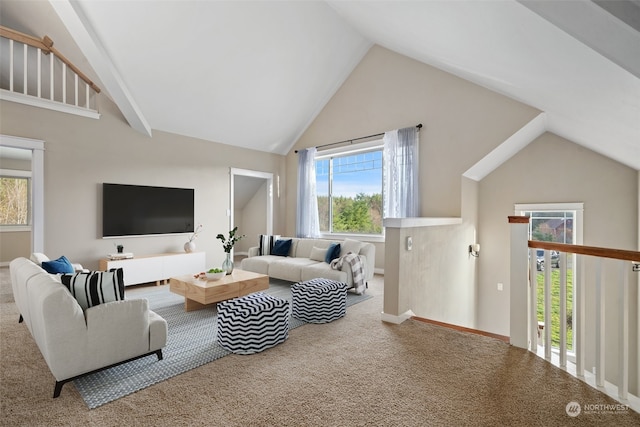 carpeted living room featuring high vaulted ceiling