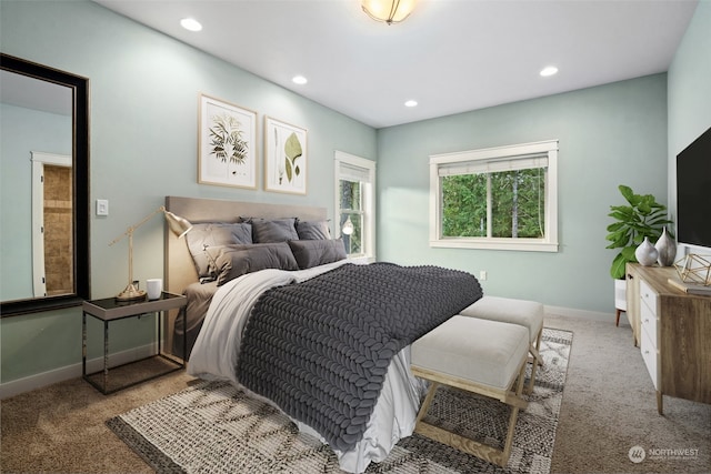 bedroom featuring light carpet