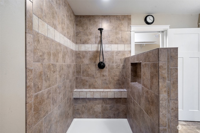 bathroom featuring tiled shower