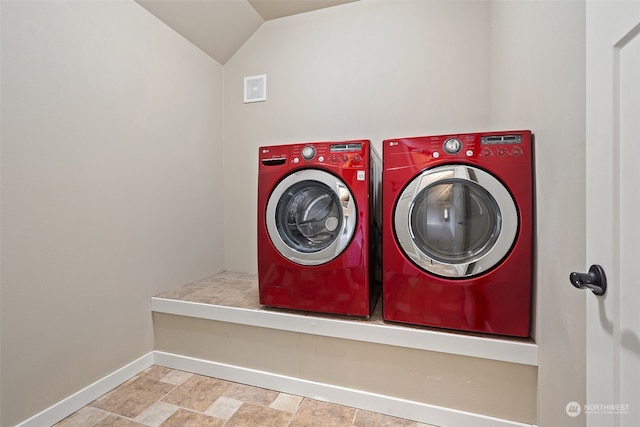 clothes washing area with washing machine and clothes dryer