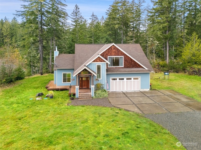 view of front of home featuring a front lawn and a garage