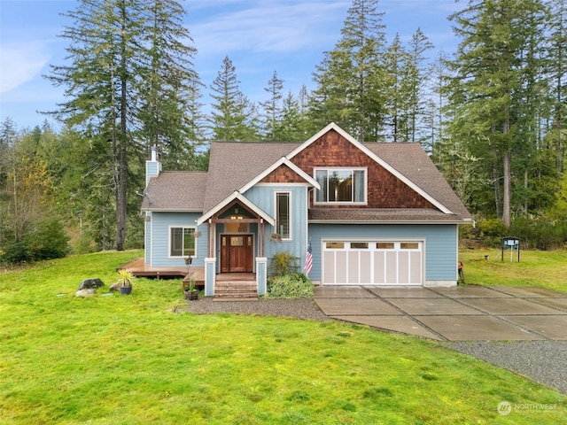 view of front of home featuring a front lawn and a garage