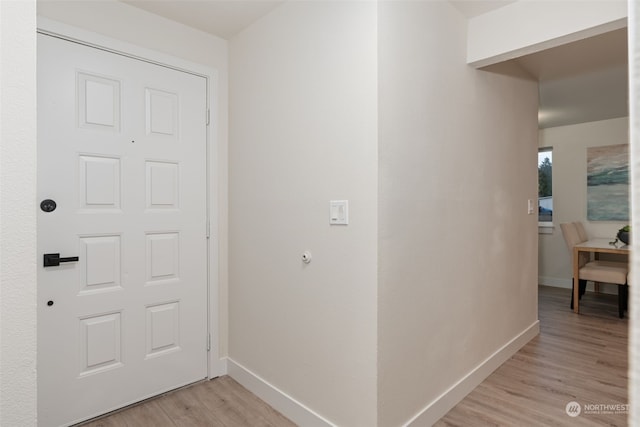 corridor with light wood-type flooring