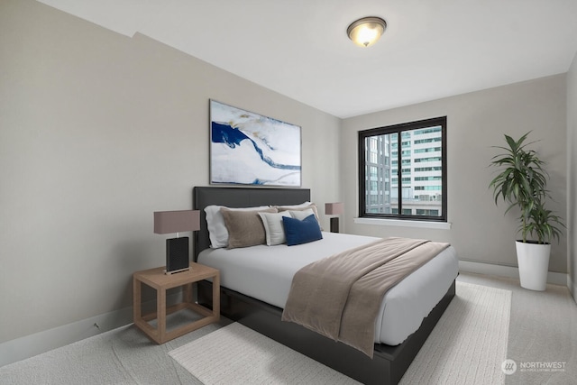 1105 Spring St Unit 701, Seattle, WA 98104 - bedroom with light carpet and baseboards