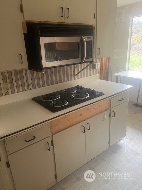 kitchen with black electric cooktop