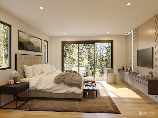 bedroom featuring light hardwood / wood-style flooring and multiple windows