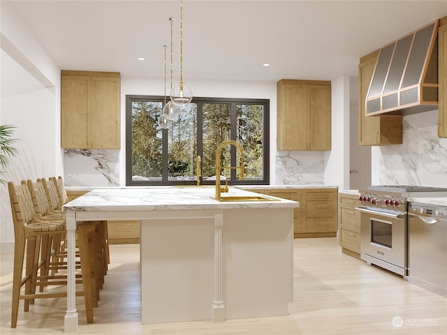 kitchen with backsplash, extractor fan, a breakfast bar, high end range, and a center island with sink