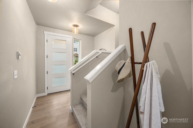 stairway featuring hardwood / wood-style flooring